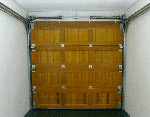 Rear of cedar door sectional wood garage door.